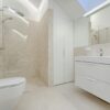 Bright and luxurious bathroom with contemporary fixtures and sleek design.